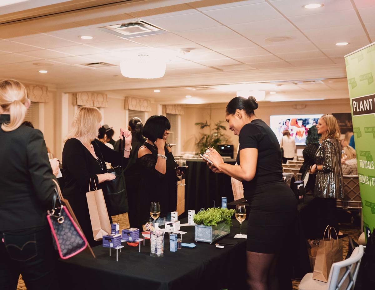 Woman excited at an Amour Women booth